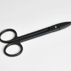 Black scissors with round handles on table.