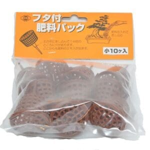 Bonsai fertilizer baskets in plastic packaging.