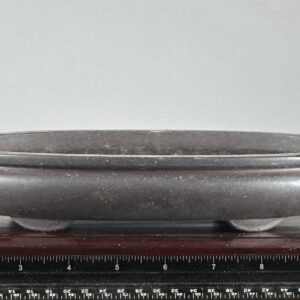Dark stone bowl with rounded edges.